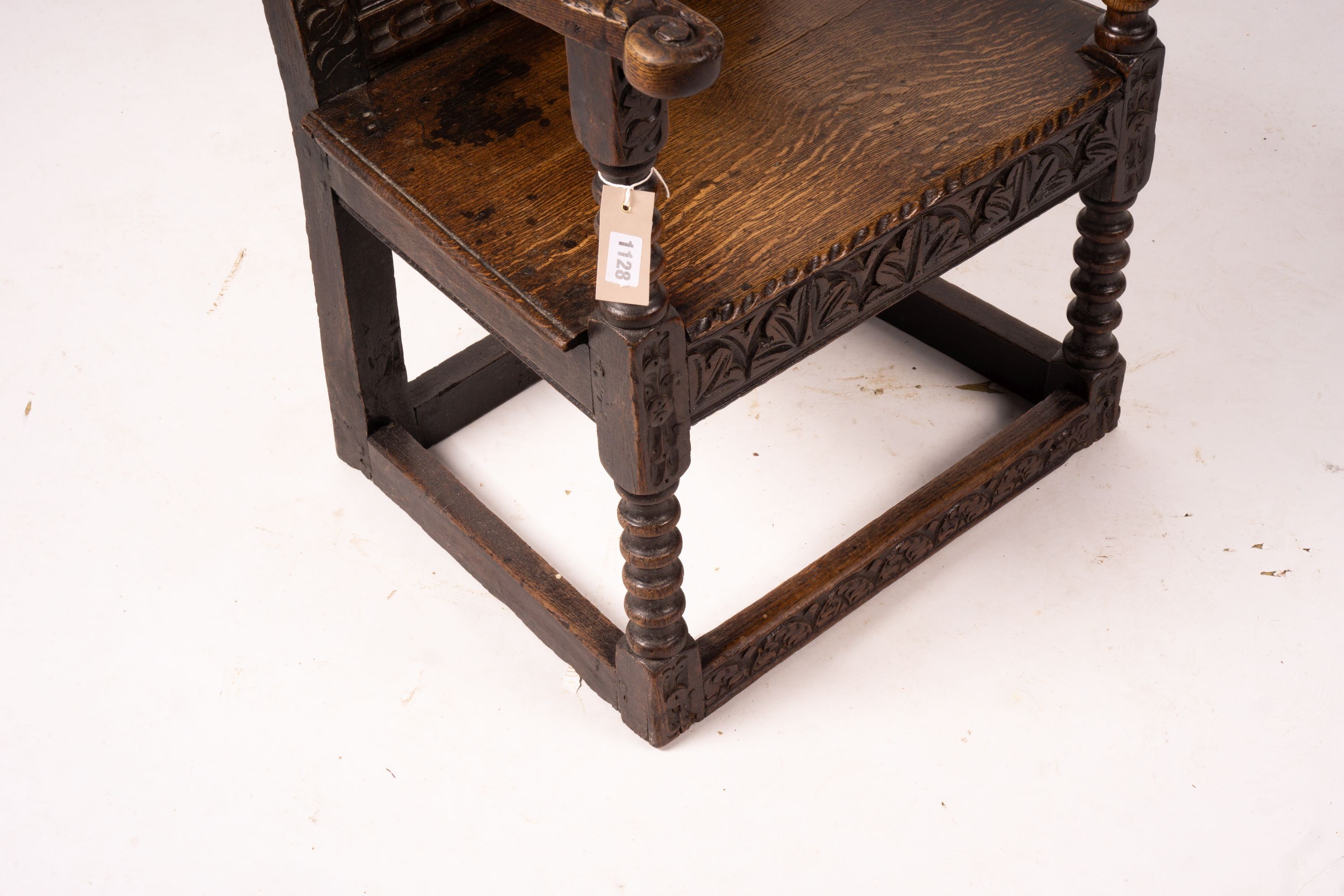 An 18th century style carved oak wainscot chair, width 56cm, depth 60cm, height 101cm